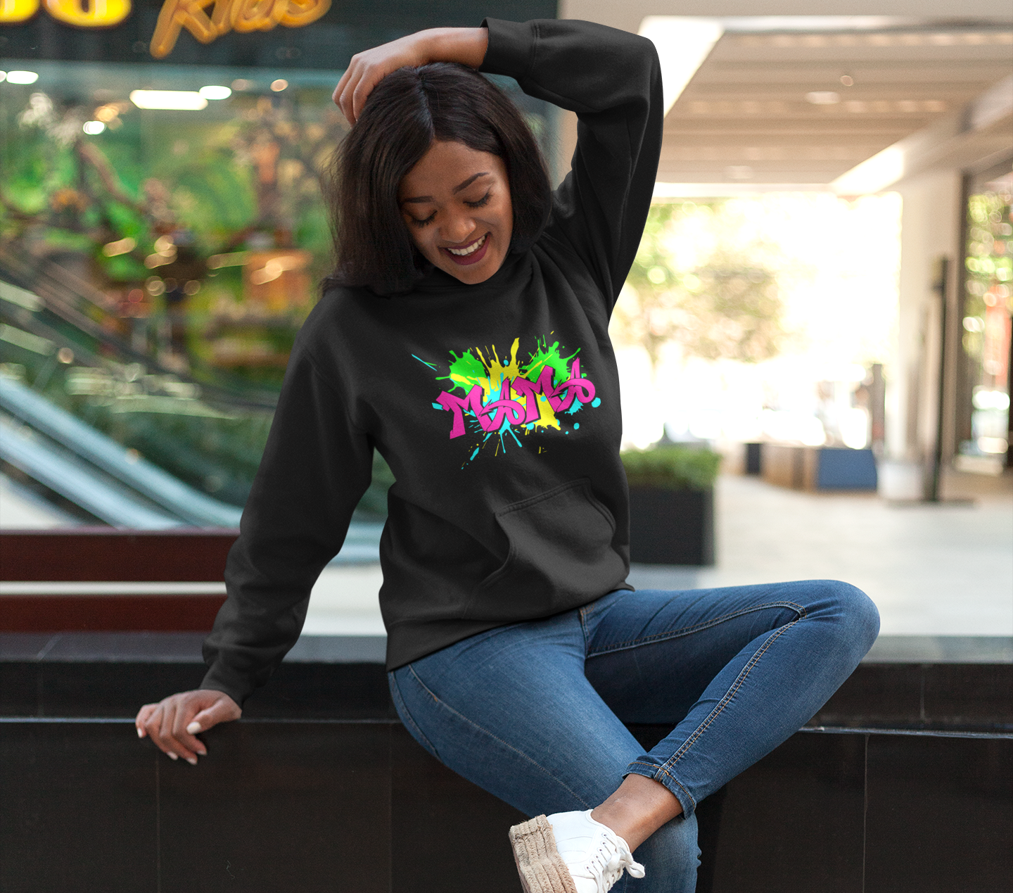 Black mama hoodie with vibrant pink granite font on neon splashes of colors. A bright vibrant twist to the ordinary mom hoodie