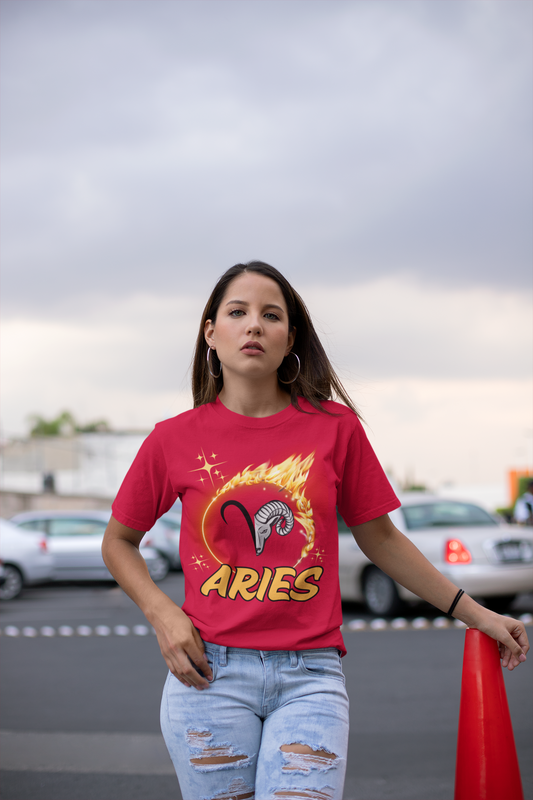 Half the aries symbol lined up with half of the rams face. Surrounded by a flaming circle and underlined with large ARIES in bold yellow font outlined in black. Red shirt