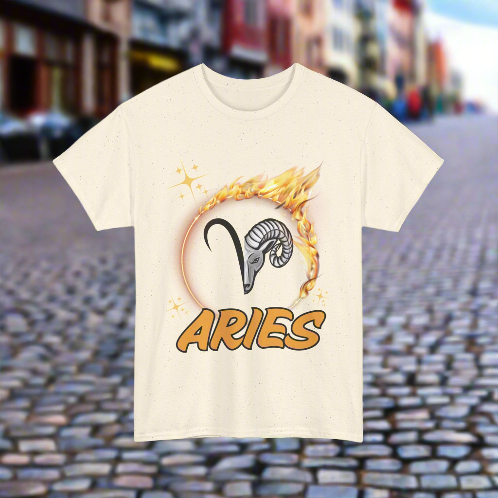 Half the aries symbol lined up with half of the rams face. Surrounded by a flaming circle and underlined with large ARIES in bold yellow font outlined in black. Natural beige shirt