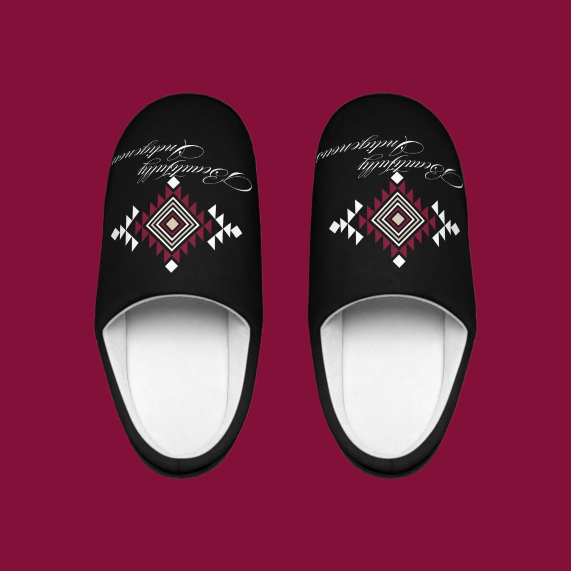 These slippers are absolutely gorgeous just like Indigenous People. This design is a tribal pattern in white, beige, and burgundy. Printed on black slippers with Beautifully Indigenous In cursive font underneath