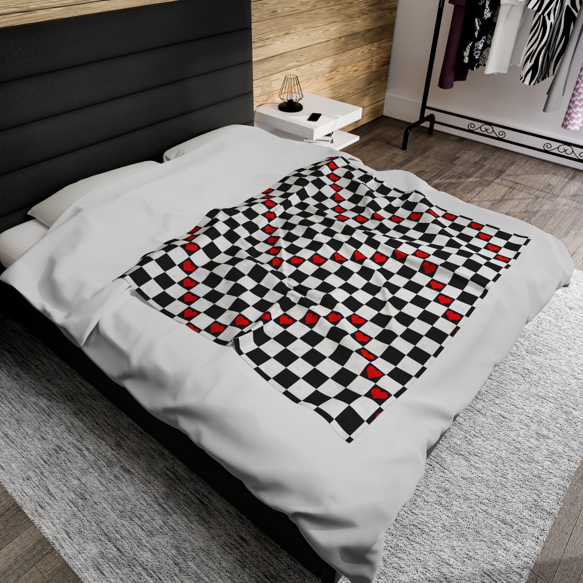 This cute blanket features the trendy black and white checkered pattern with red hearts sporadically placed in the black checkers. 