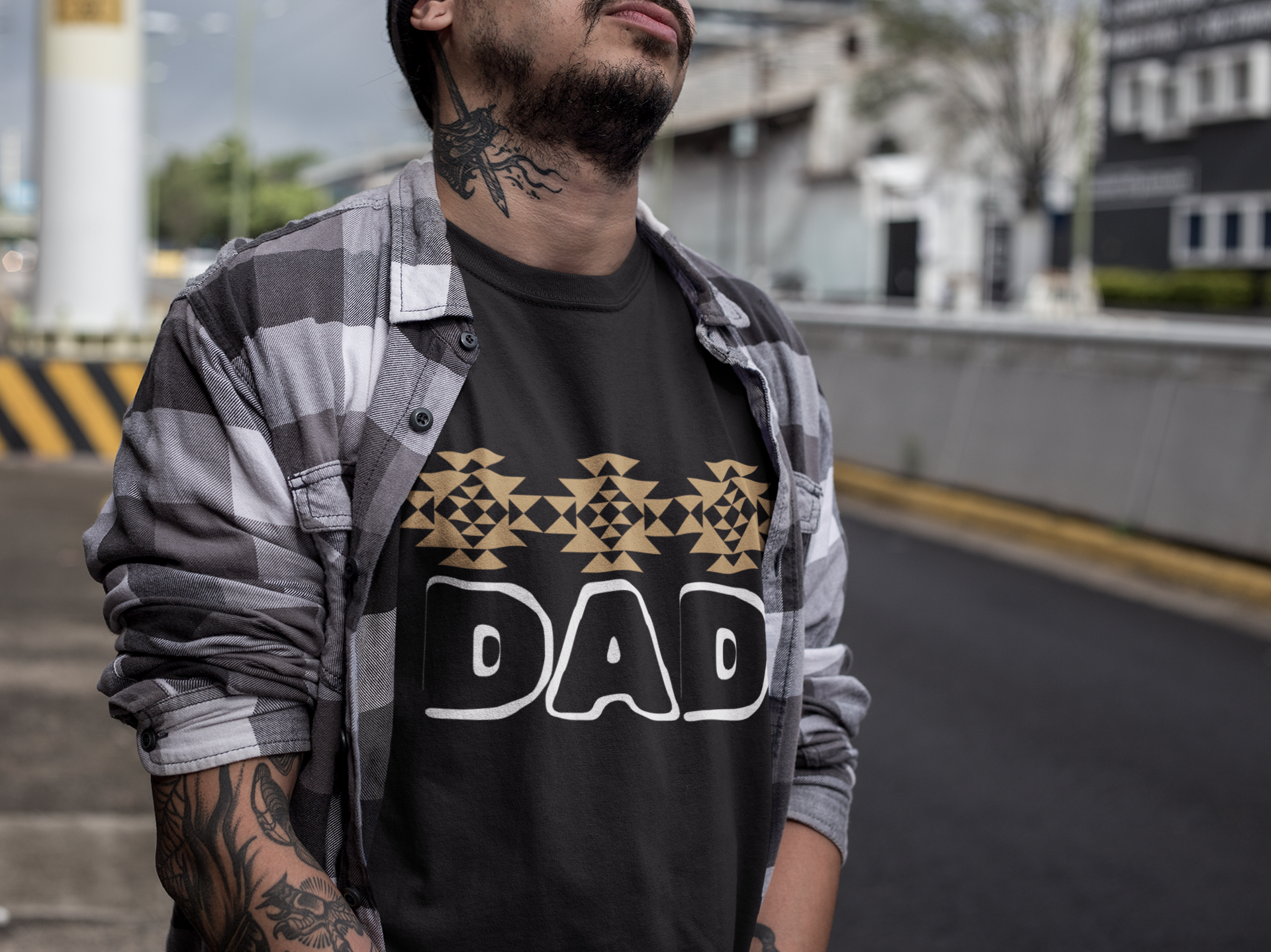 Tribal print across chest with large hollow DAD font in white underneath - black