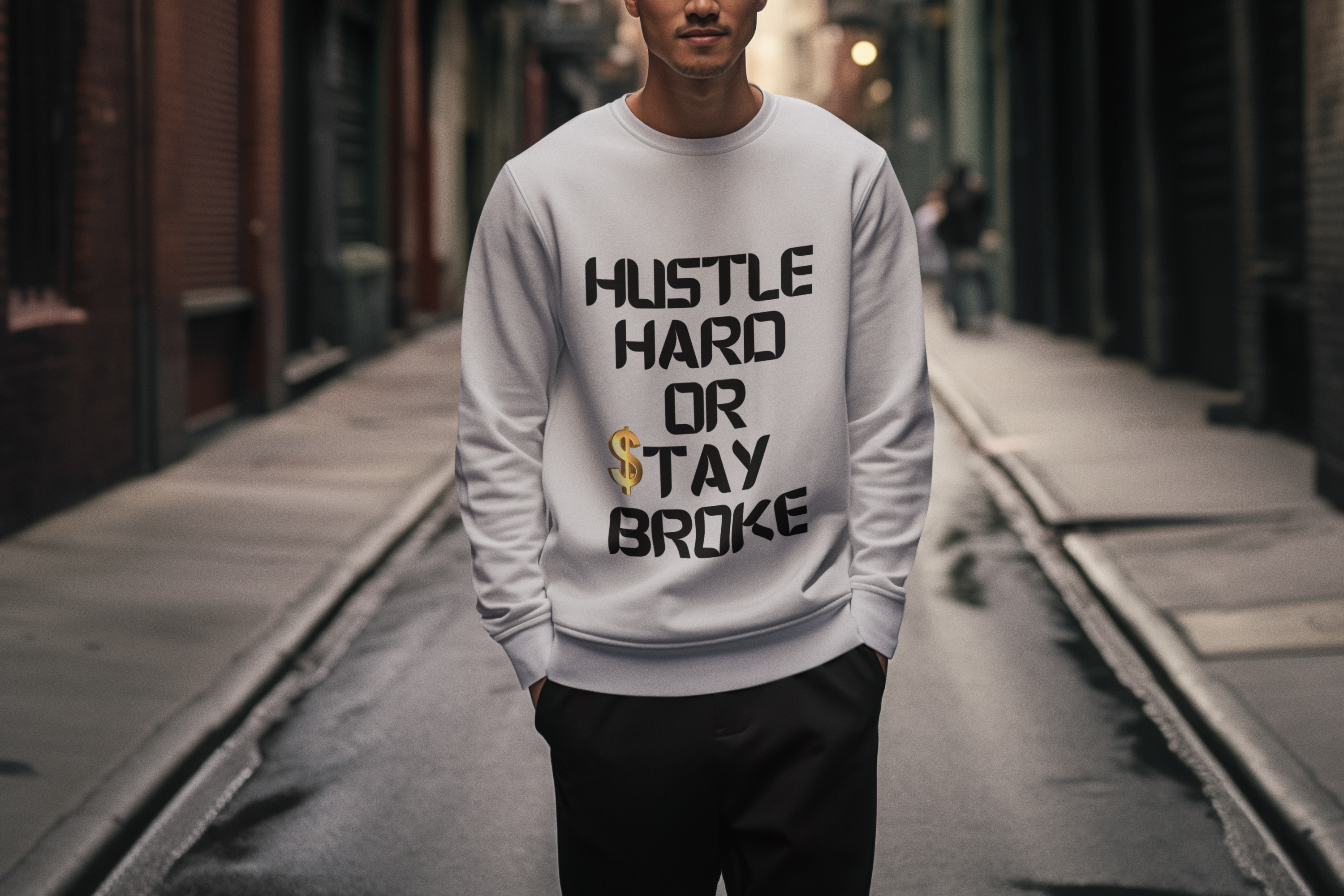 A sport grey crewneck sweatshirt with Hustle Hard or Stay Broke in a bold black digital style font - the S in Stay is a striking gold dollar sign. A motivational design as a reminder for you and inspiration for others. Get yours today and wear your hustle proudly!