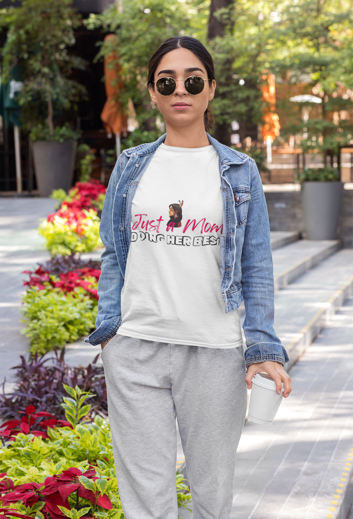 Just a Mom Tshirt - a native woman side profile with Just a Mom in red handwritten font - Doing her best in bolder black font. Speaking for all the beautiful Mama's that are consistent and show up for their baby's. 