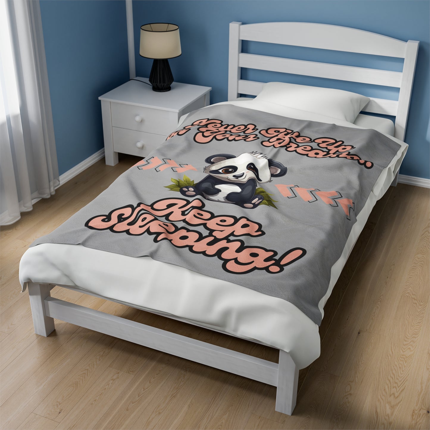 This adorable panda in the center of this grey blanket has a fun retro font printed above saying Never Give Up On Your Dreams above and Keep Sleeping below. 