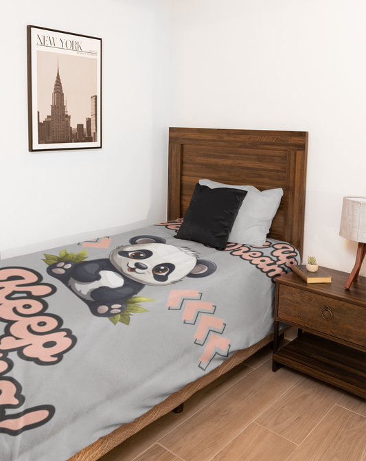 This adorable panda in the center of this grey blanket has a fun retro font printed above saying Never Give Up On Your Dreams above and Keep Sleeping below. 