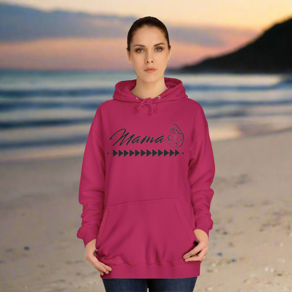 Mama Hoodie - Tribal Print - Woman standing in hot pink hoodie with tribal print across the chest. Mama printed in Cursive Font with a silhouette of a mother and baby