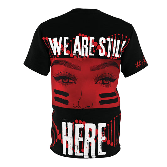 No More MMIP Tshirt Black base tshirt - back side has a red dna twisting in the background, bold white font printed WE ARE STILL , womens eyes with warrior lines through the middle, same background and font prints HERE. Representing Native Americans and the MMIW MMIP Movement