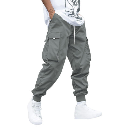 Make an absolute statement and elevate your streetwear game with these Oversized Men's Cargo Pants. The pockets are functional, and the oversized design delivers complete comfort. Versatile enough to be dressed up or down. - dark grey