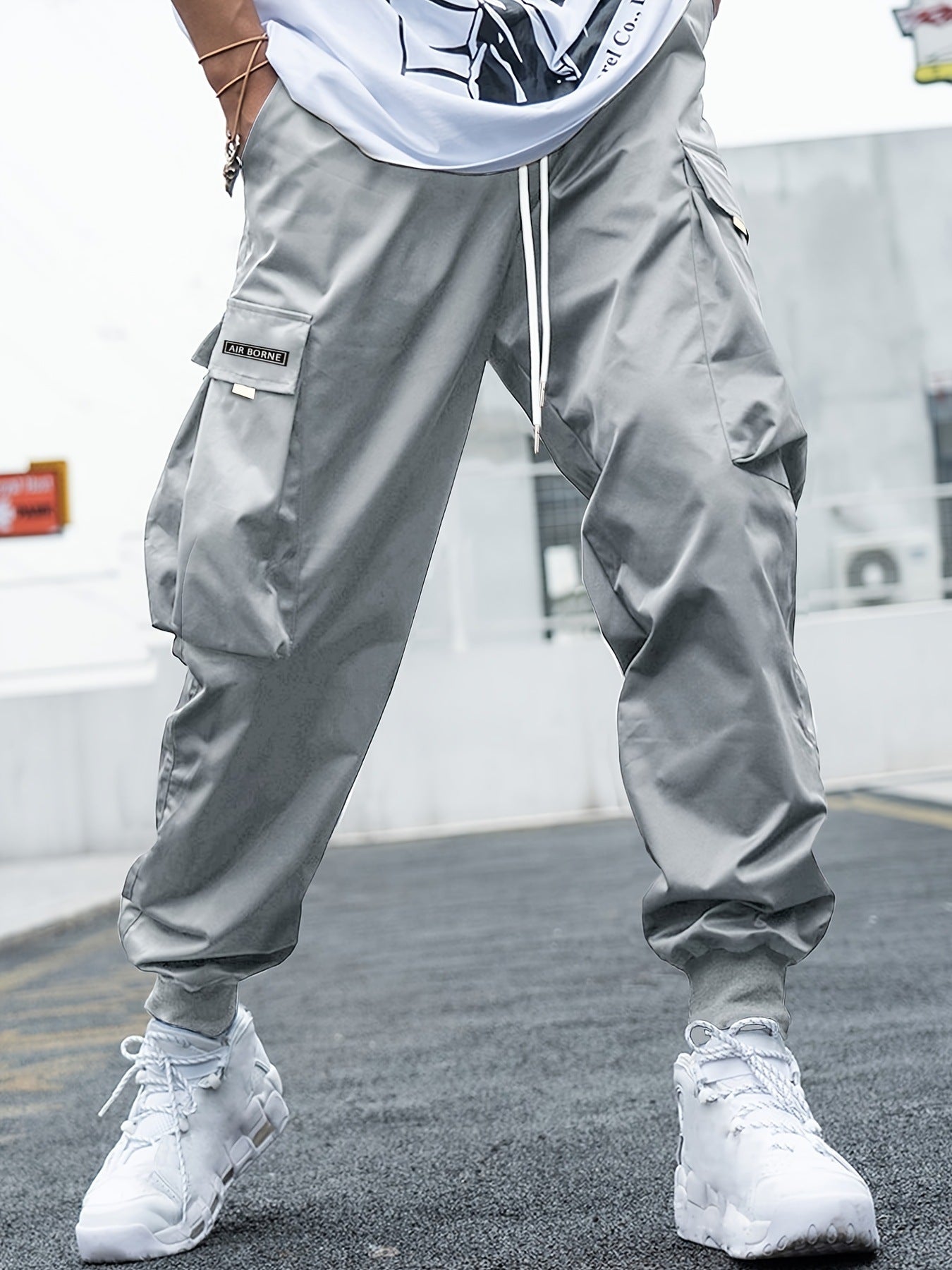 Make an absolute statement and elevate your streetwear game with these Oversized Men's Cargo Pants. The pockets are functional, and the oversized design delivers complete comfort. Versatile enough to be dressed up or down. - grey