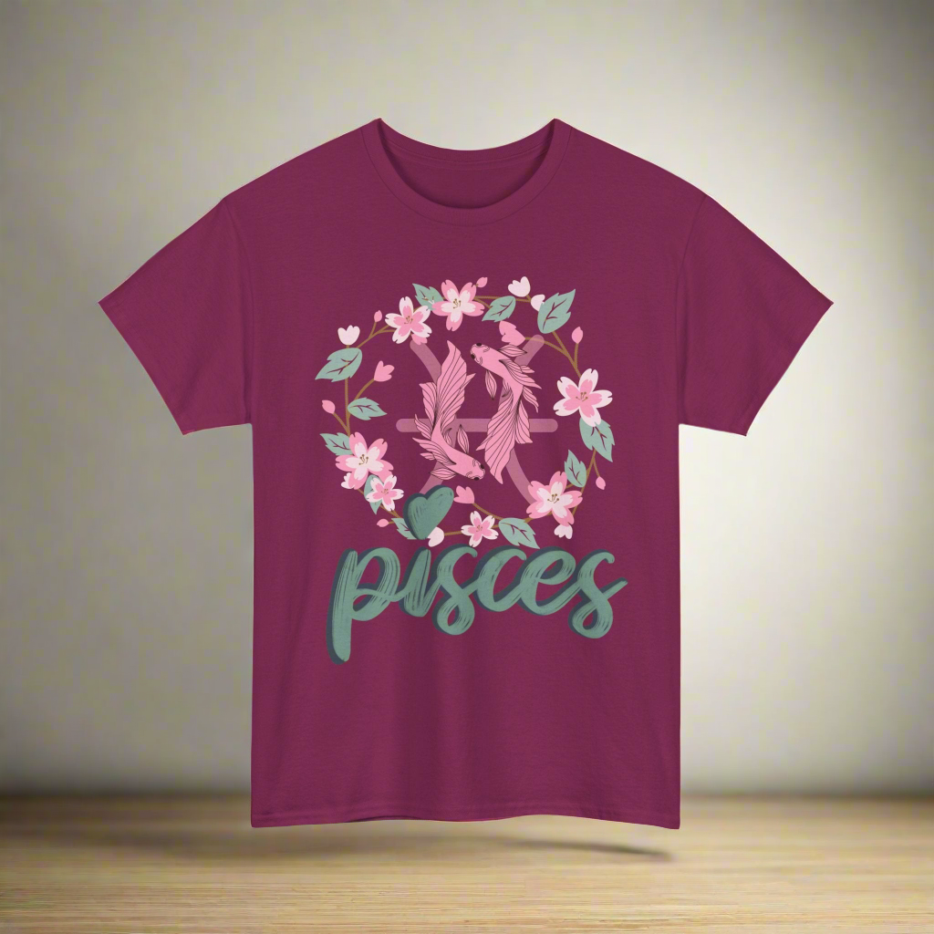 Pisces Horoscope Tshirt with 2 pink pisces fish surround with a light brown stem twisted into a circle with green leaves and pink flowers. Underneath Pisces is printed in light green font with navy blue shadow on a berry shirt