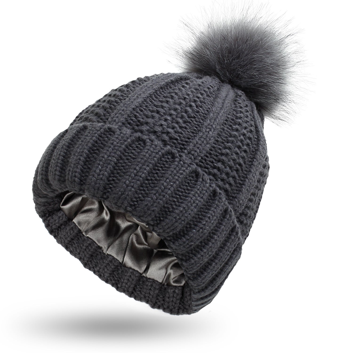 Pom Pom Beanie in grey with a knitted design and fur pom pom. This beanie is Satin Lined so say goodbye to frizzy beanie hair.