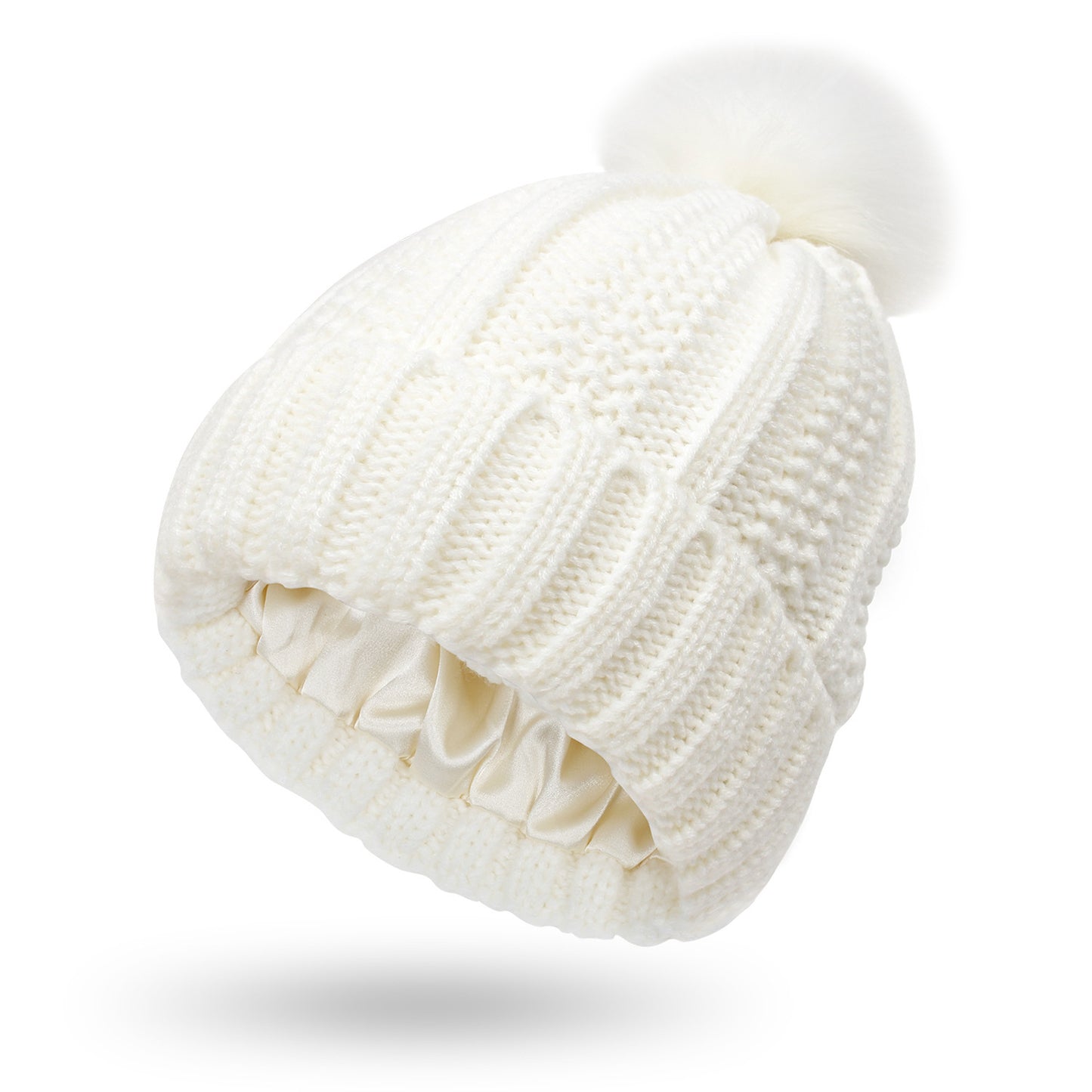 Pom Pom Beanie in white with a knitted design and fur pom pom. This beanie is Satin Lined so say goodbye to frizzy beanie hair.