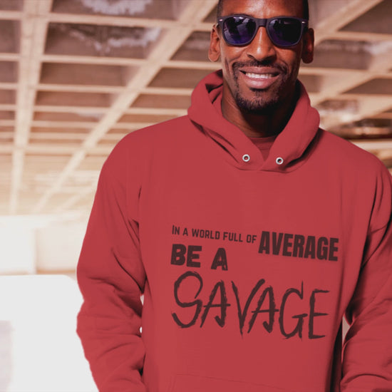 In a world full of average be a Savage. Printed on a soft, breathable hoodie. The top font is standard, average is gold, be a is bolder, and SAVAGE is in a scratched looking font. Red