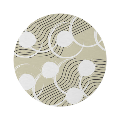 neutral colored round area rug with a cream tan colored base with white circles and black abstract lines