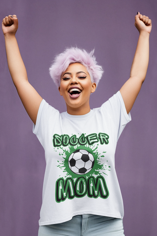 Soccer Mom Tshirt - Soccer Mom written In hollow Graffiti font outline in black and green with a Soccer ball in the center with green paint splattered around it - white