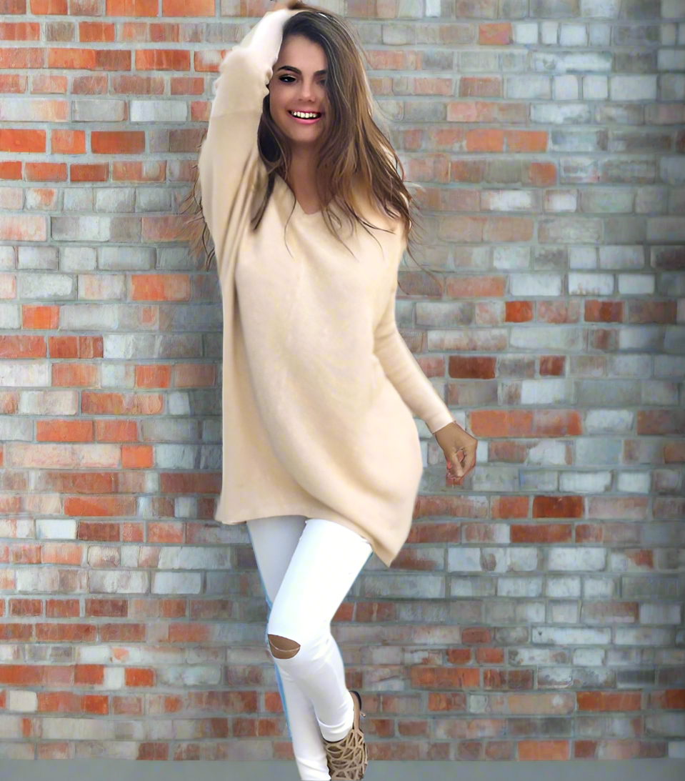 absolute style and comfort is what the vneck oversized womens sweater is giving The oversized look gives a casual style while the vneck provides a level of elegance. - beige