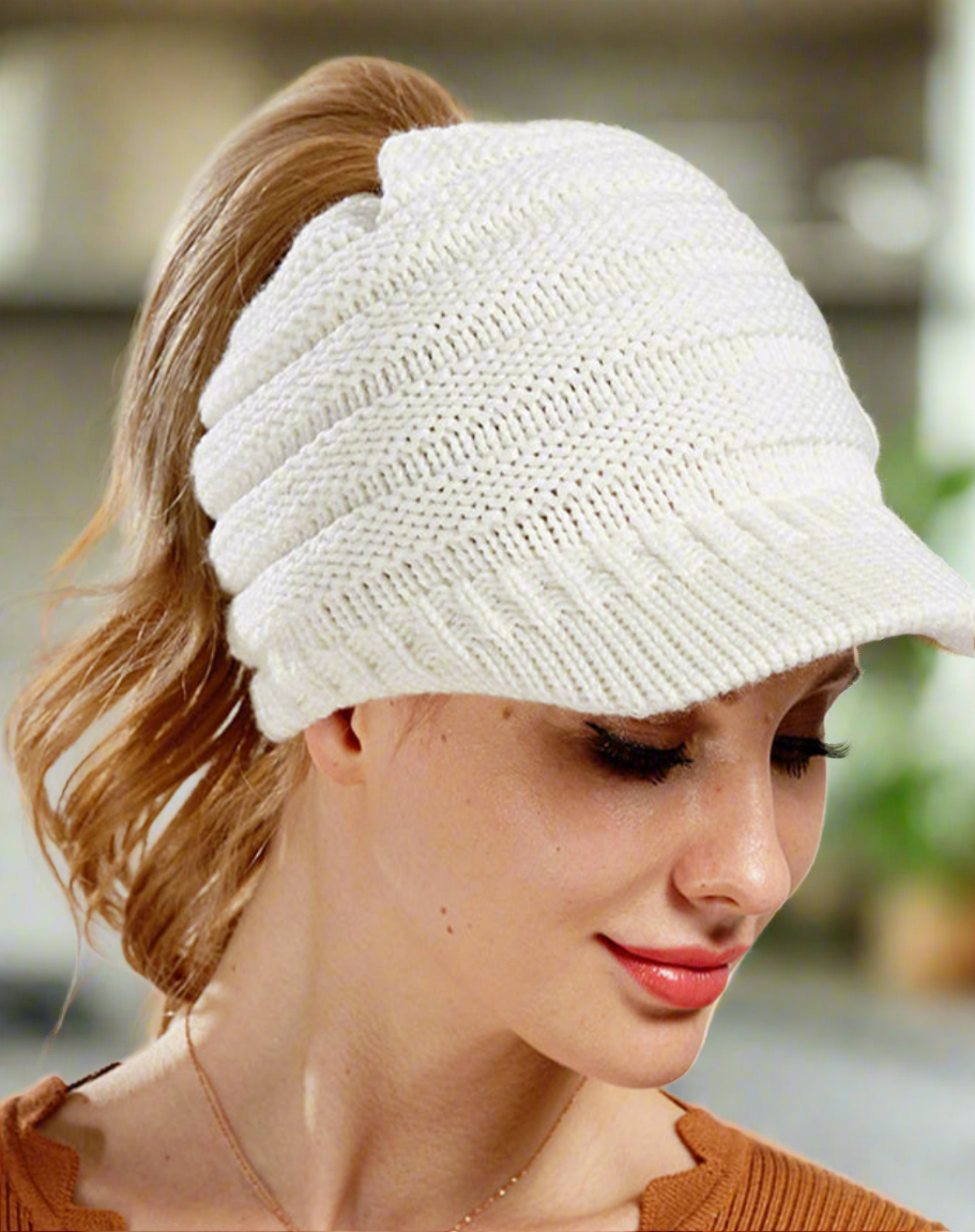 Womens Ponytail beanie in the white color. Versatile for any outfit. The perfect combo of cute and comfy. Keep your head warm and have an effortless hair day!