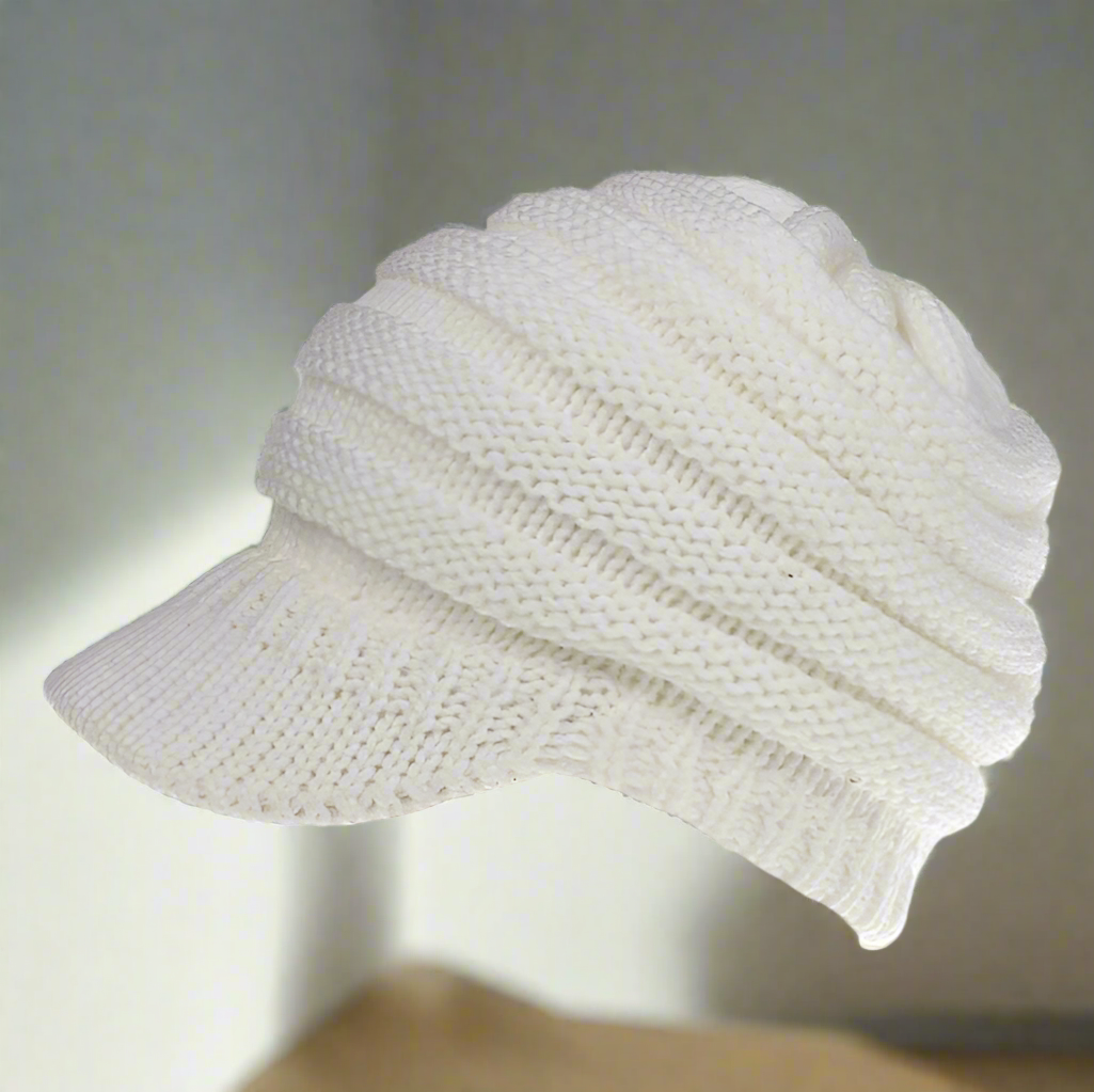 Womens Ponytail beanie in the white color. Versatile for any outfit. The perfect combo of cute and comfy. Keep your head warm and have an effortless hair day!