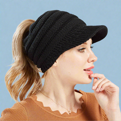 Womens Ponytail beanie in the black color. Versatile for any outfit. The perfect combo of cute and comfy. Keep your head warm and have an effortless hair day!