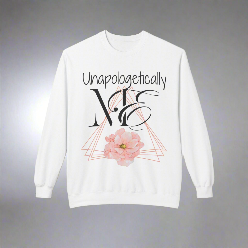 Pink triangle outlines stacked at different angkes with a beautiful pink flower on the bottom center. Unapologetically written in handwritten type font. ME written in half proper half cursive font with the E wrapping around the M. Elegance, Confidence, and fun all wrapped up into one beautiful crewneck. - white