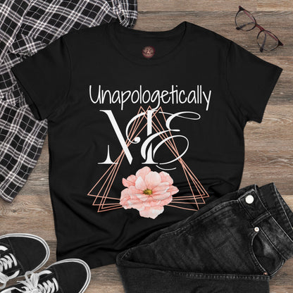 Women's Unapologetically Me Tshirt - Offset peach colored triangles with one solid peach flower in the bottom center - Unapologetically in handwritten font over ME in a large proper and then cursive wrapped around the M. Exuding all the confidence that women should have with a but of style and attitude. - black